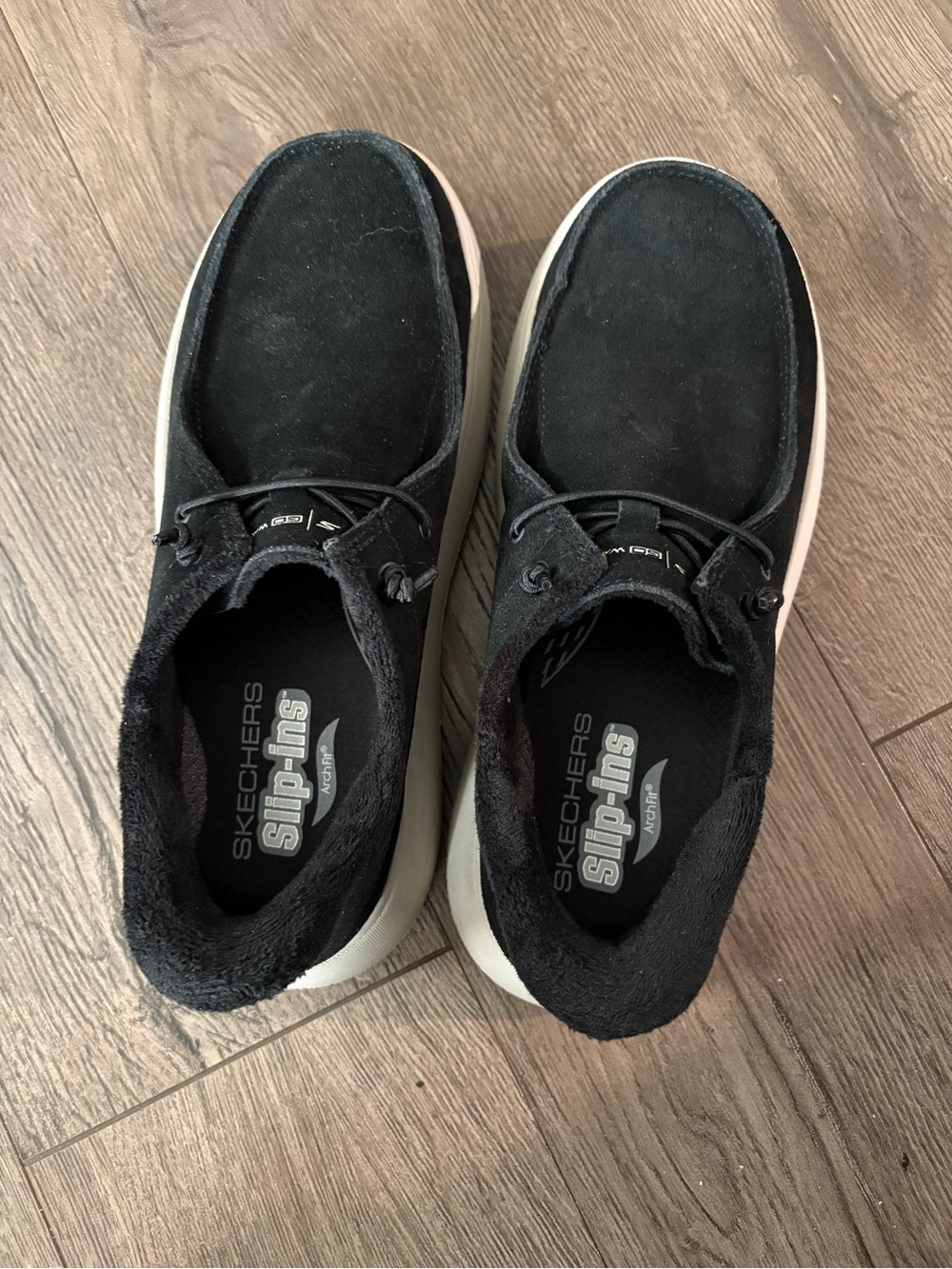 Skechers Black Slip-Ons with White Sole